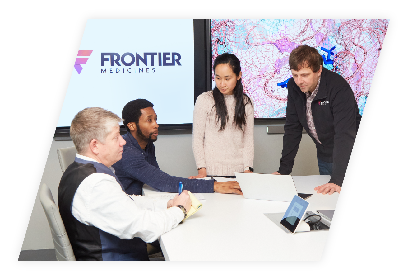 Group of Frontier Medicines employees walking down corridor